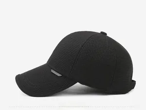 Close-up of black winter baseball cap with textured woven fabric and side logo detail