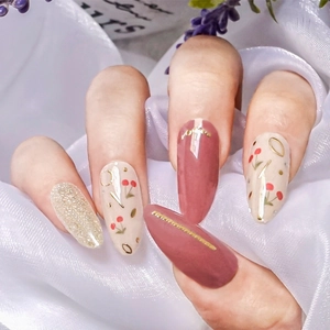 Japanese style floral nail wraps featuring cherry patterns and golden glitter accents