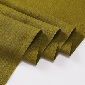 Detailed macro view of olive green faux cashmere fabric texture with soft drapery