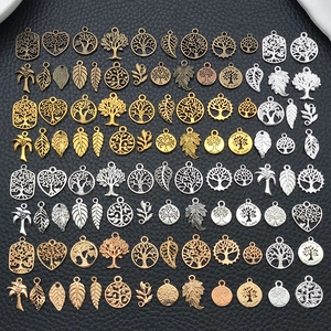 Mix of vintage life tree and heart alloy charms in gold, silver and bronze for DIY jewelry