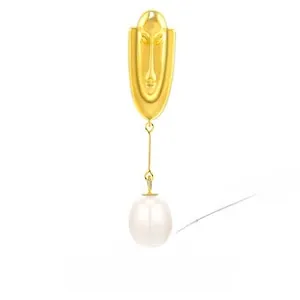Detail of S925 silver necklace with golden face pendant and white teardrop pearl charm