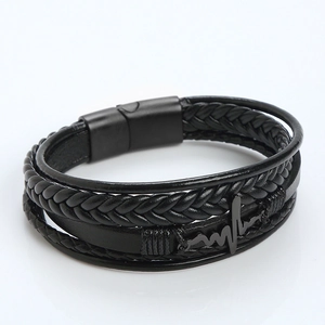 Detail of multilayer black leather bracelet with heartbeat charm and magnetic metal clasp
