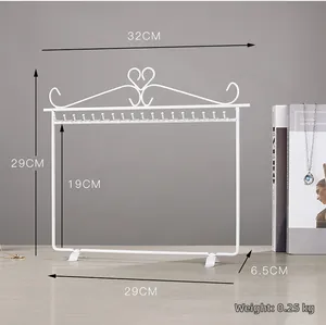 White metal jewelry rack with heart decoration and 20 hooks for hanging necklaces