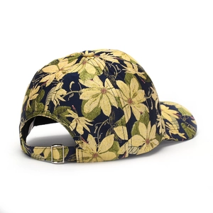 Navy floral baseball cap with yellow flower print and silver metal adjustable buckle back