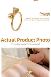 Macro detail of a golden bow knot ring crafted from polished titanium steel for women