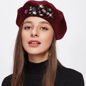 Elegant wine red wool beret for women featuring colorful rhinestones on a grey background