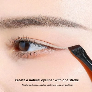 Macro shot of flat angled eyeliner brush with synthetic bristles for eye makeup