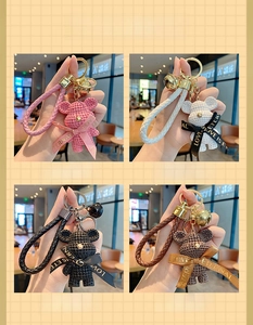 Detailed set of knitted bear keychains in pink, white, black, and coffee colors
