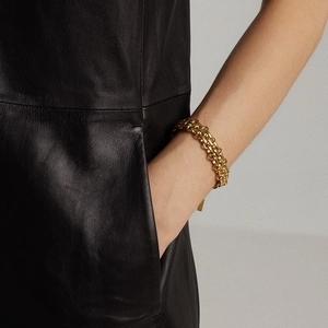 Chunky gold titanium steel chain bracelet featuring a polished vintage industrial style