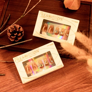 Luxury handmade press-on nails with amber blush gradient pearls and diamond accents