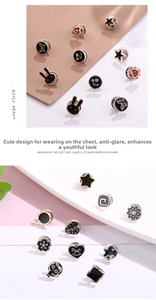 Detailed close-up of cute enamel pins and pearl brooches in floral and animal shapes