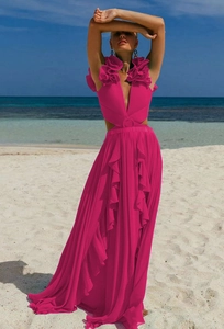 Detail of rose pink deep V-neck maxi beach dress with waist cut-outs and ruffles