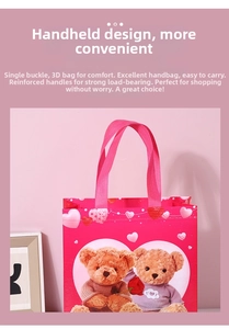 Close-up of pink non-woven gift bag with reinforced handles and cartoon teddy bear print