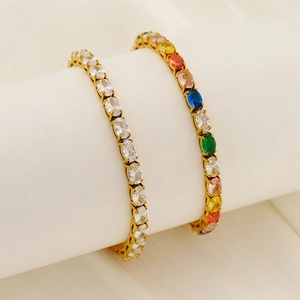 Elegant gold-plated tennis bracelets featuring white and multicolor oval-cut cubic zirconia