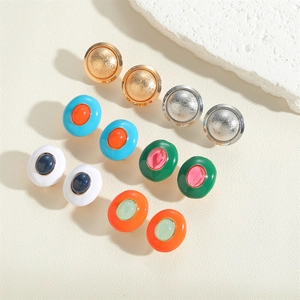 Detail showing colorful enamel oval earrings set in vintage French style metal