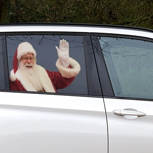 Santa Claus PVC car window sticker on a white vehicle window for Christmas decor