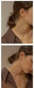 Elegant s925 silver pear-shaped earring set with pearls worn by a model in a minimal style