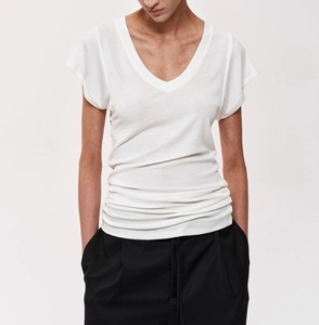 Close-up of slim-fit white V-neck T-shirt showing high-quality wool tencel fabric texture