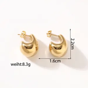 Detail view of gold hollow hoop earrings with size measurements on white background
