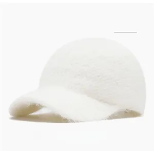 Close-up of soft off-white fluffy knit baseball cap texture in premium rabbit fur