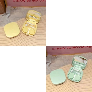 Detail view of yellow and green contact lens case sets with mirror and full tool kits