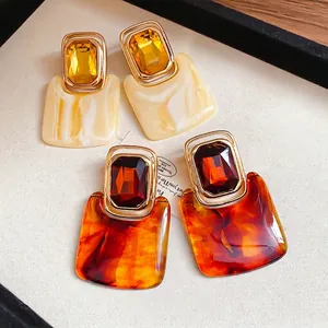 Vintage geometric resin earrings with crystals in marble and tortoiseshell patterns