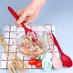 Red, pink, and green silicone spoons and slotted spoons set for cooking and mixing