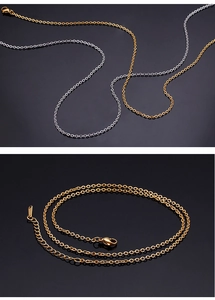 Detail of stainless steel O-chain necklaces in gold and silver with lobster clasps