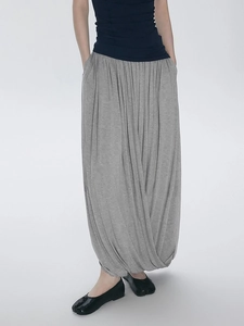 Dark gray pleated harem skirt pants with irregular Chinese style design shown on model