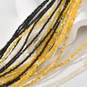 2-2.5mm natural black white and yellow shell bead necklaces on display stand