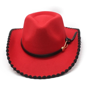 Detail of red wool felt cowboy hat featuring black whipstitch edge and leather band