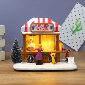 Christmas musical popcorn wagon village scene with LED light and festive figurines