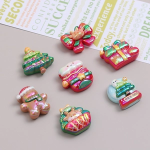 Christmas resin accessories featuring gingerbread man, tree, and gift box for DIY crafts