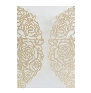 Intricate laser-cut rose patterns on gold glitter wedding invitation sleeve detail