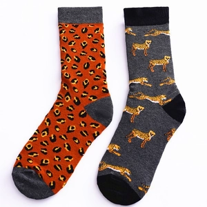 Adult cotton crew socks featuring mismatched orange leopard print and grey cheetah patterns