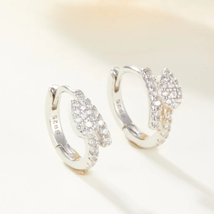 Macro shot of S925 sterling silver snake earrings with micro-pave cubic zirconia