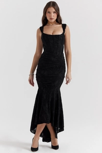Detail of the black textured embossed fabric on a sleeveless fishtail evening dress