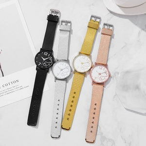Collection of quartz heart watches in gold and silver on marble background