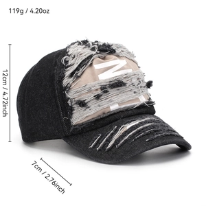 Distressed denim baseball cap in black with khaki patch and white M letter embroidery