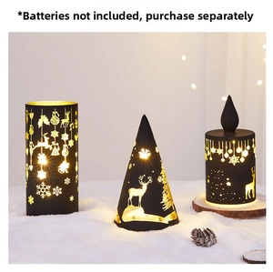 Close-up of black hollowed Christmas LED lamps with reindeer and snowflake patterns