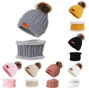 Detailed cable knit baby hat and scarf set with pompom and leather tag in various colors