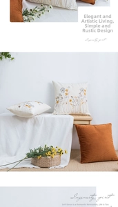 Detail of floral embroidery on cotton canvas pillows and caramel velvet cushion cover