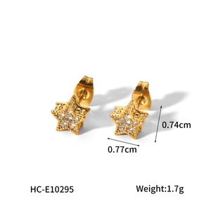 Detailed view of gold star stud earrings with crystals and precise dimensions