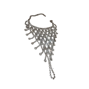 Elegant mesh rhinestone hand harness bracelet with crystal tassels on white background