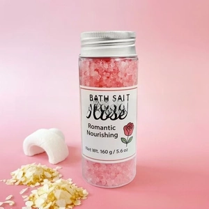 Detailed shot of pink rose bath salt in a 160g clear jar with rose petal decorations