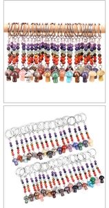 Macro detail of natural stone mushroom keychains with colorful chakra bead accents