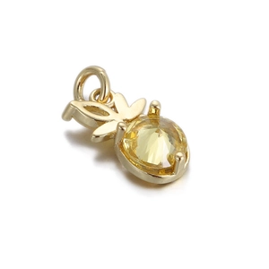 Detailed view of a 14k gold-plated pineapple pendant charm with yellow faceted crystal