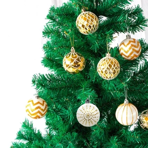 Close-up of gold and white 6cm Christmas balls with various textures on tree branches