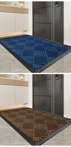 Detail showing the geometric woven texture and durable black rubber edge of the door mat