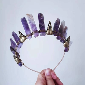 Detail of amethyst quartz crown with brass skulls and wire-wrapped gothic headband